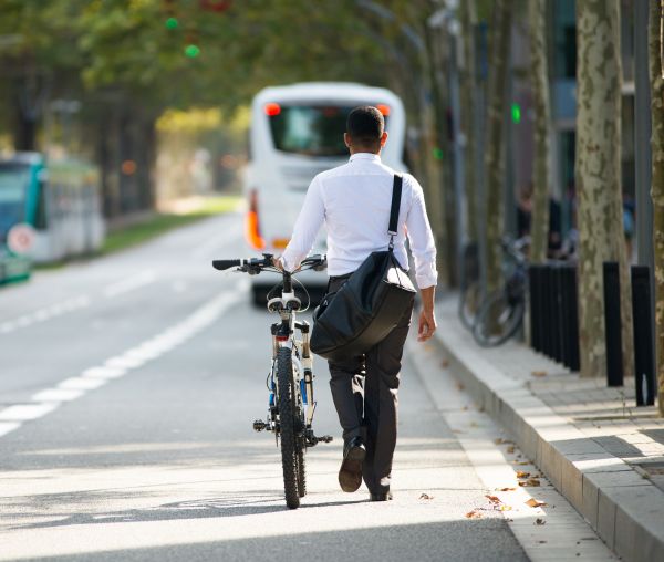 businessman walking ebike